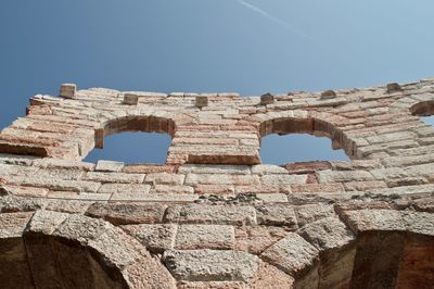 Low angle view of old ruins against the sky