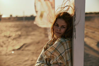 Portrait of young woman looking away