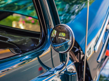 Close-up of vintage car on side-view mirror