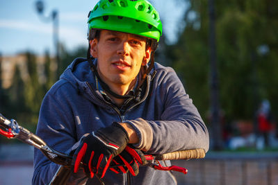 Portrait of man wearing cycling helmet