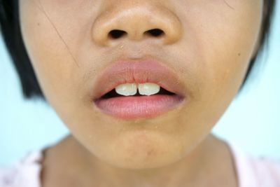 Close-up of girl showing teeth