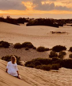 Woman in white dres in the desert