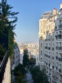 Buildings in city against clear sky