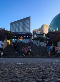 People in city against clear sky