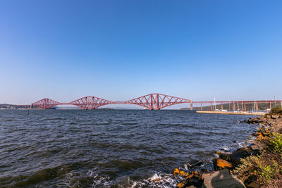 View of bridge over sea against clear sky