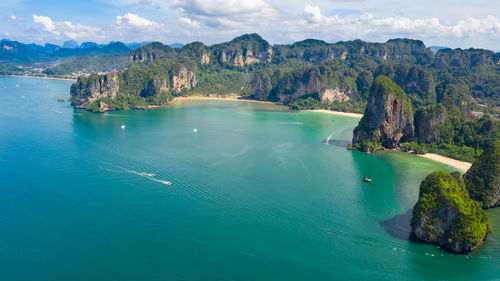 Panoramic view of sea and mountains against sky