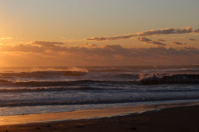 Scenic view of sea against sky during sunset