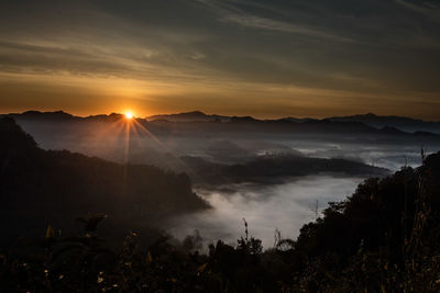 Scenic view of mountains against sky during sunset