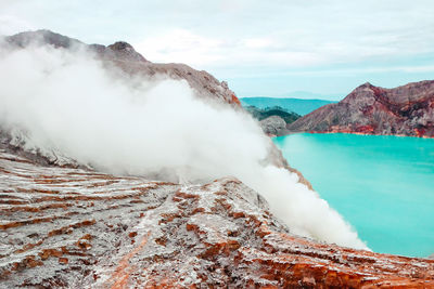 Close-up of rock formation amidst smoke