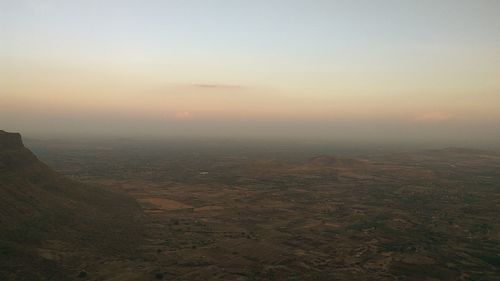 Scenic view of landscape against sky during sunset