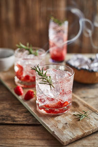 Close-up of drinks on wooden table