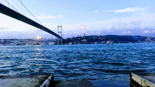 Bridge over sea against sky