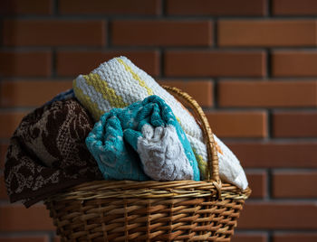 Close-up of wicker basket on wall