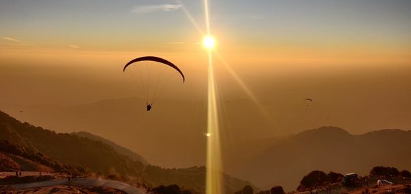 Scenic view of mountains against sky during sunset