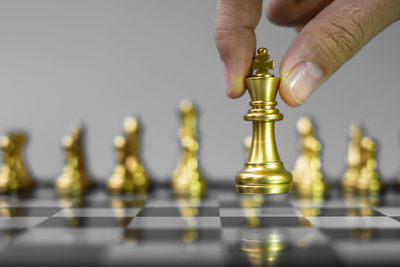 Low angle view of man playing on chess board