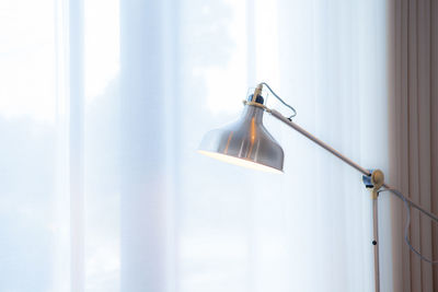Close-up of electric hanging on wall