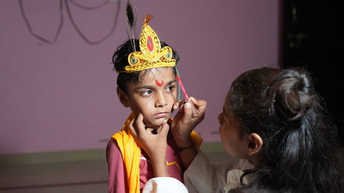 Indian little artistes getting ready to perform in the janmashtami festival.