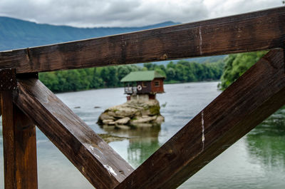 Pier over lake against sky