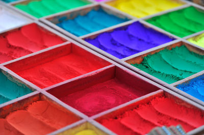 Full frame shot of colorful powder paints in boxes for sale