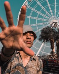 Portrait of young man in amusement park