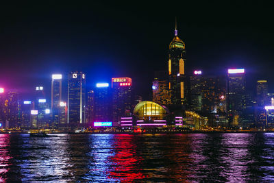 Illuminated buildings in city at night