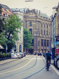 People in city against sky