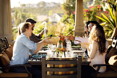 Friends eating at dining table