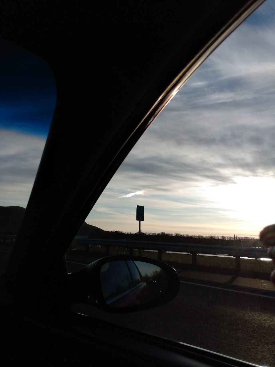 VIEW OF BRIDGE THROUGH CAR WINDSHIELD