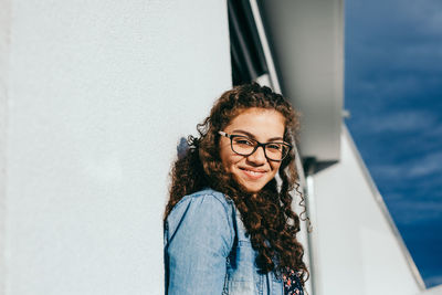 Portrait of smiling young woman in water
