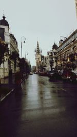 View of cathedral in city against clear sky