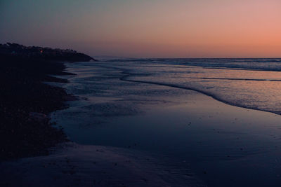 Scenic view of sea against sky at sunset