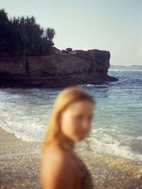 Girl at the beach in nusa lembongan, indonesia. shot on 35mm kodak gold 200 film.