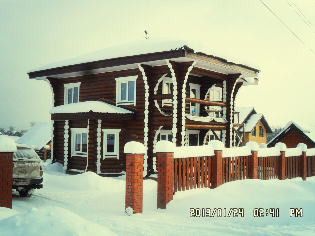 architecture, building exterior, built structure, snow, text, clear sky, roof, winter, house, white color, day, cold temperature, sky, outdoors, no people, low angle view, sunlight, residential structure, religion, communication