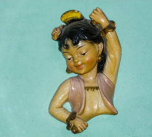 Close-up of statue against blue background