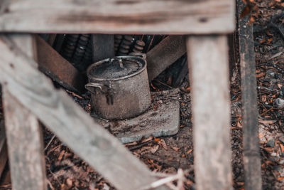 High angle view of rusty metal on wood