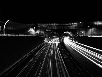 Light trails on railroad tracks at night