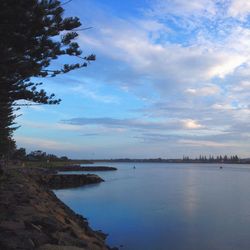 Scenic view of sea against cloudy sky