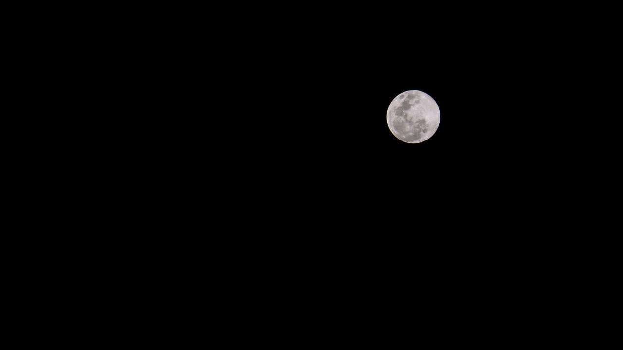 LOW ANGLE VIEW OF MOON AGAINST SKY