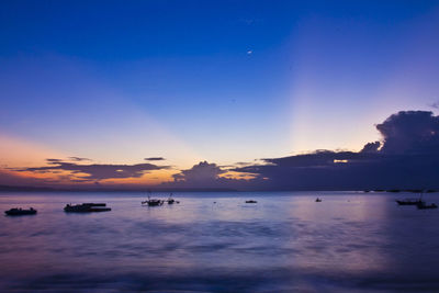 Scenic view of sea against sky at sunset