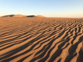 Scenic view of desert against clear sky