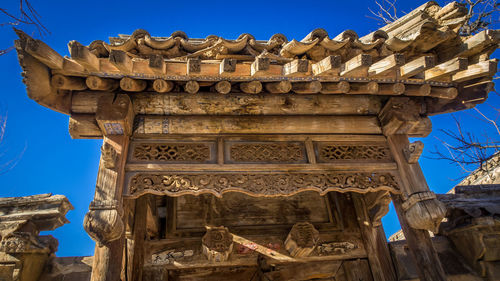 Low angle view of building against clear blue sky