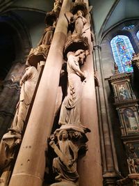 Low angle view of statue against building