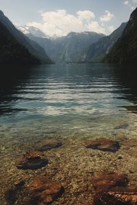 Scenic view of lake and mountains against sky