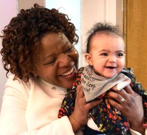 Portrait of happy mother holding baby