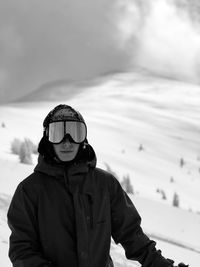 Portrait of teenage boy standing on snow