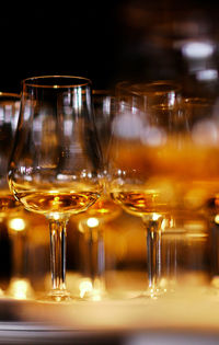 Close-up of wine glasses on table