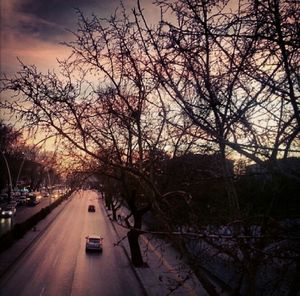 Cars on road at sunset