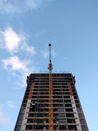 Low angle view of skyscraper against sky