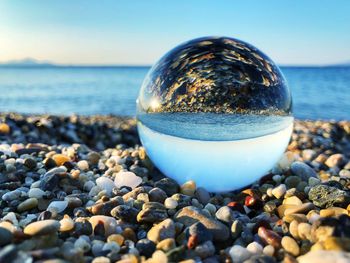 Sea view mirrored in a glass ball