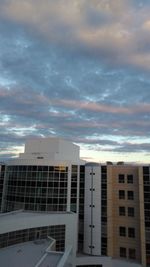 Modern building in city against sky